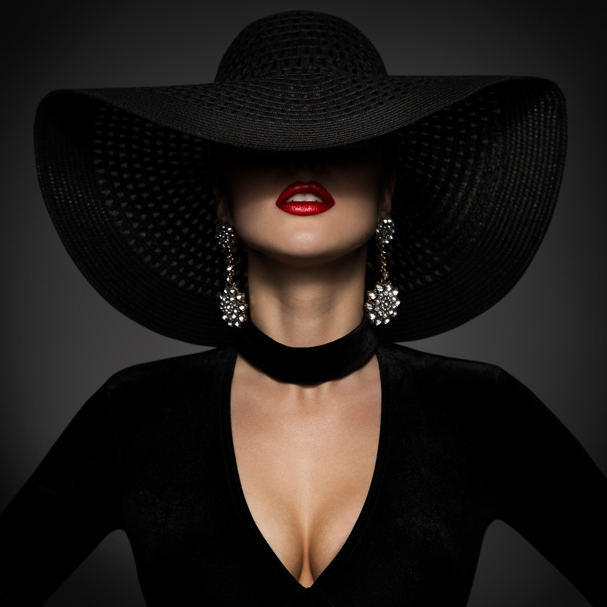 Fashion Model in Sexy Black Dress, Elegant Woman Beauty in Wide Broad Brim Hat covered face